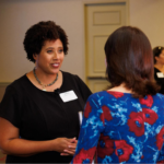 Lesley speaks to a school leader at USC's Melbo Lecture