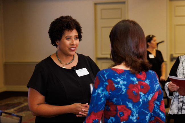 Lesley speaks to a school leader at USC's Melbo Lecture