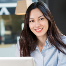 Smiling woman with long dark hair