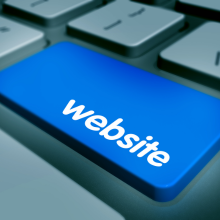 Blue website button on a laptop