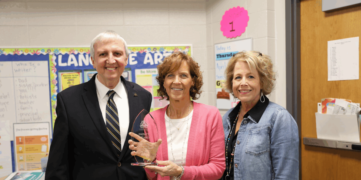 Penn-Harris-Madison School Corporation Superintendent Dr. Thacker, Mrs. Orosz, and Mary Frank Principal Christie Heerschop.