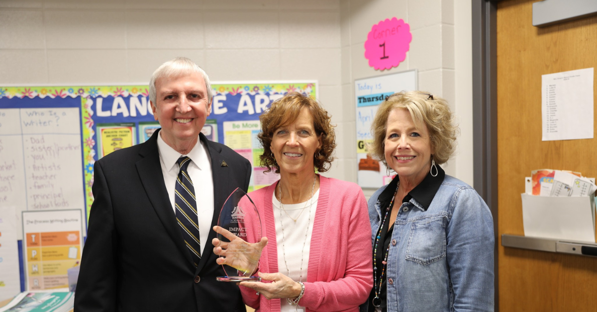 Penn-Harris-Madison School Corporation Superintendent Dr. Thacker, Mrs. Orosz, and Mary Frank Principal Christie Heerschop.
