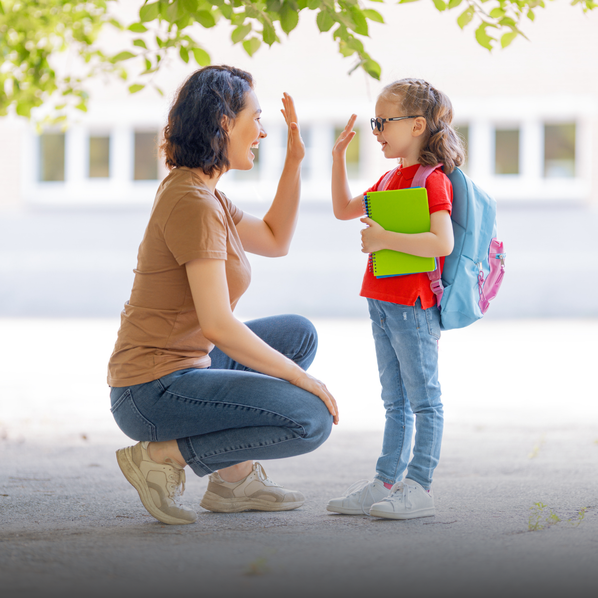 Mom giving daughter high five