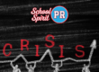 Stick figures drawn in chalk holding up red letters reading "CRISIS"
